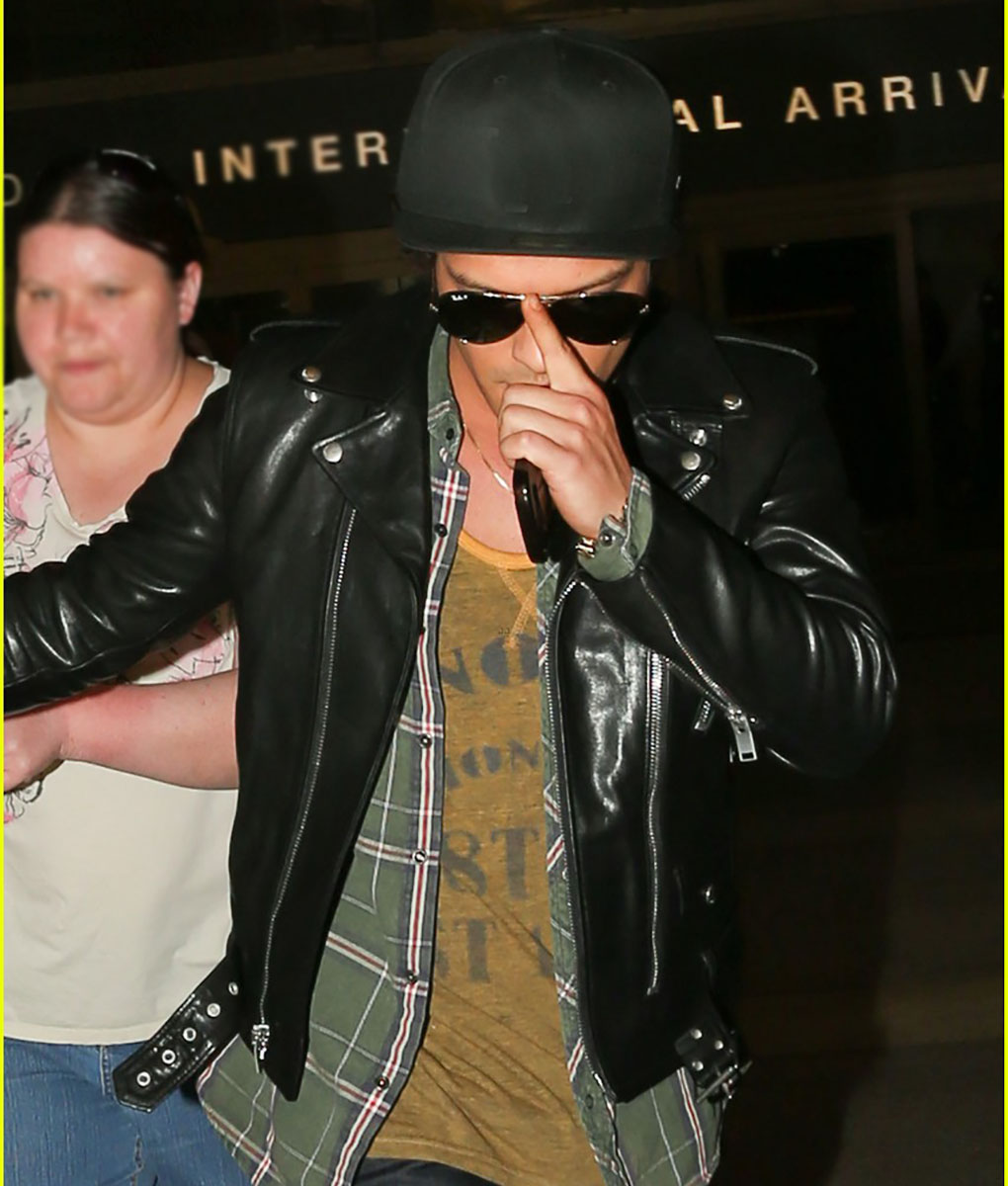 Bruno Mars Sports A LA Dodgers Hat As He Greets Fans Outside Of LAX